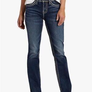 Dark wash skinny jeans with white stitching